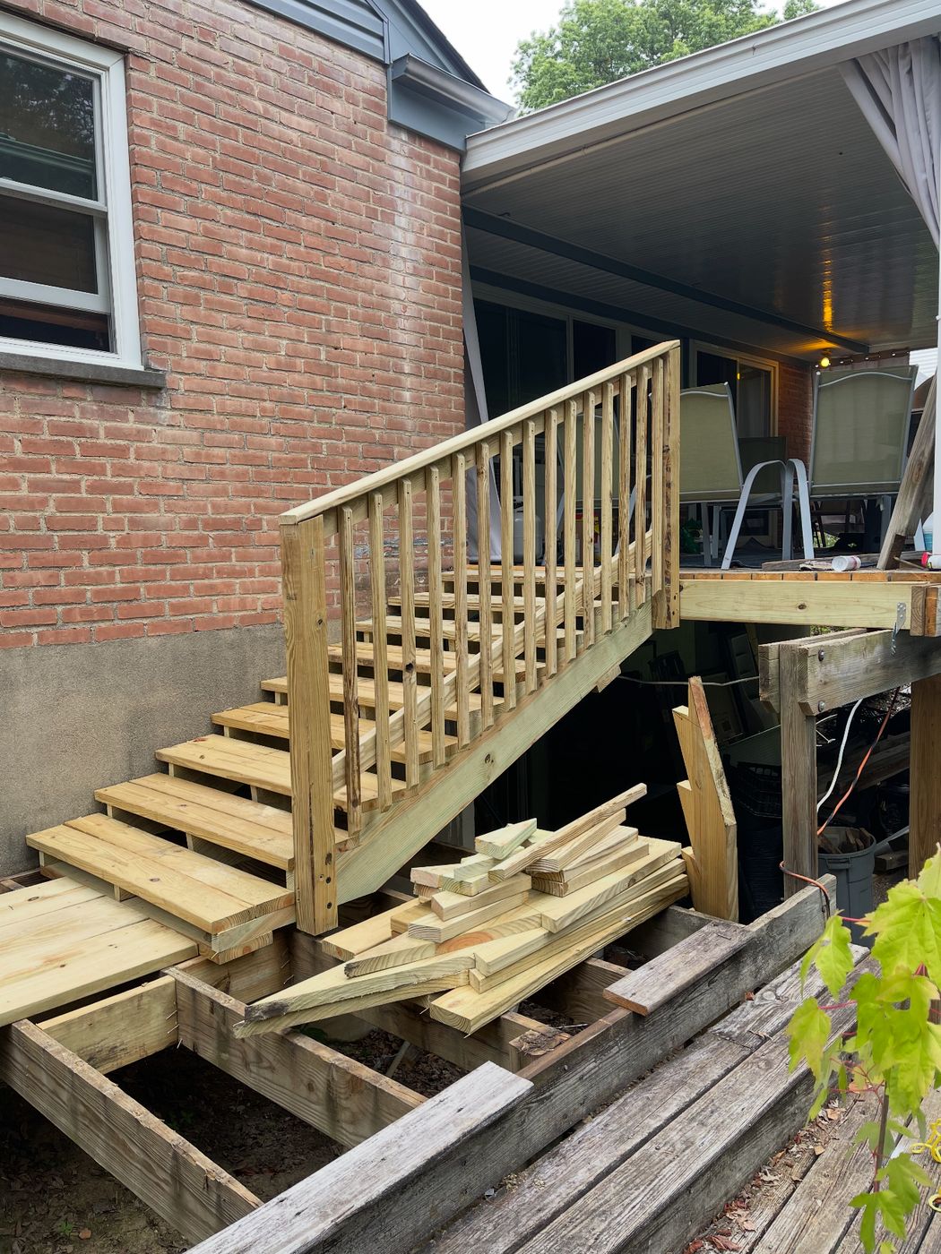 Rebuilt deck stairs with 4-inch handicap-accessible risers and new railing