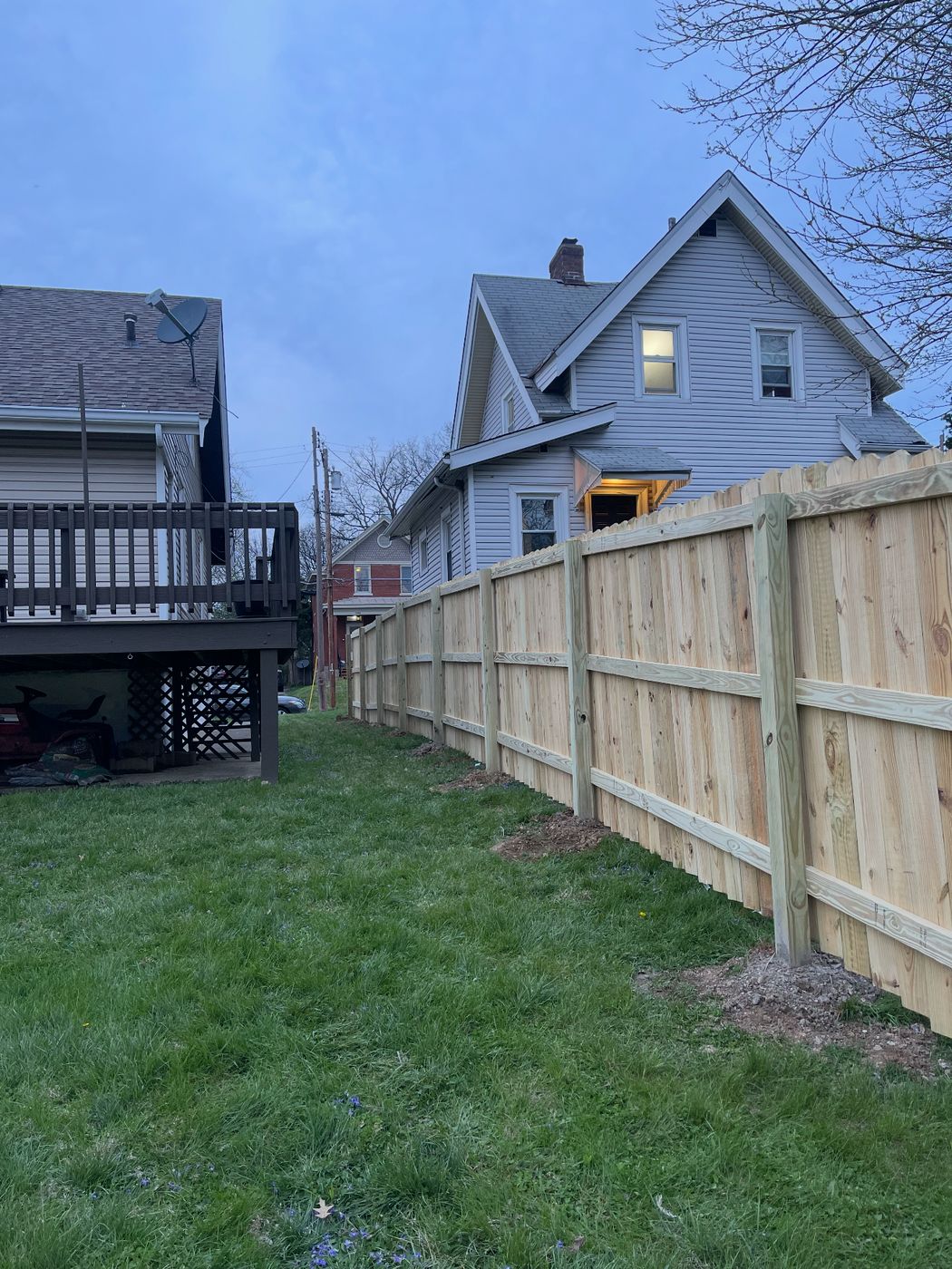 70 feet of new wood privacy fence along a side yard, completed in 2 days
